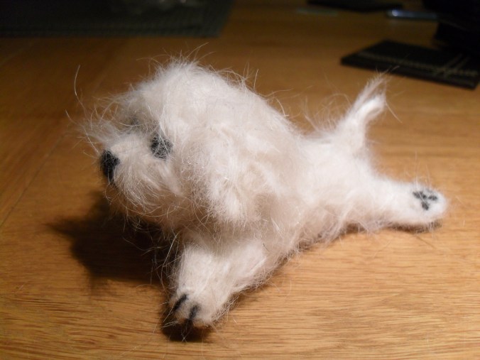 Needle felting using dog hair.