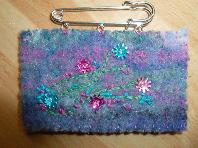 Small embellished brooch.