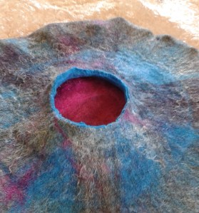 The first layer is cut away to reveal the colour below.