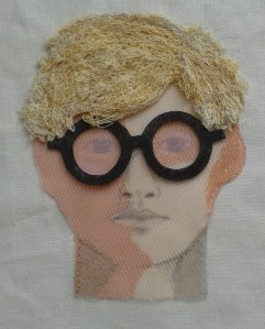 Portrait of Hockney made from fabric and thread.