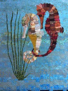 A colourful quilt featuring two seahorses.