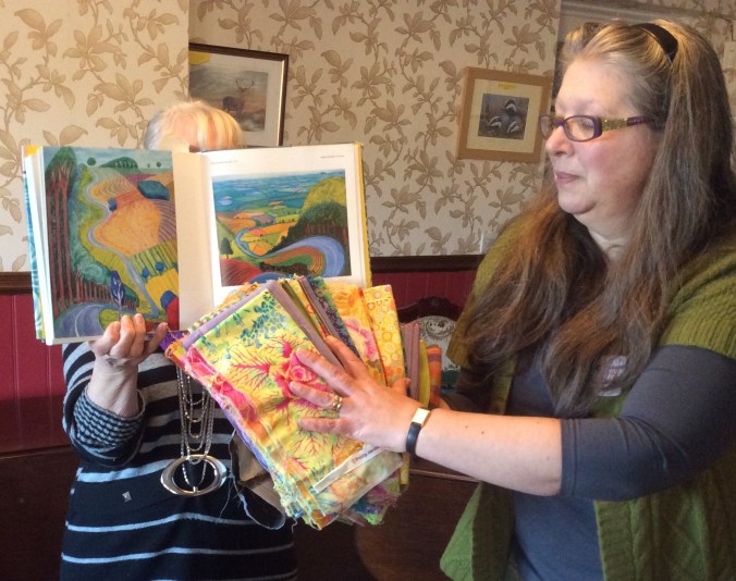 Rosie shows the fabrics she will use for her quilt.