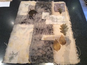 Trying different layouts incorporating dried leaves and stamped dragonflies