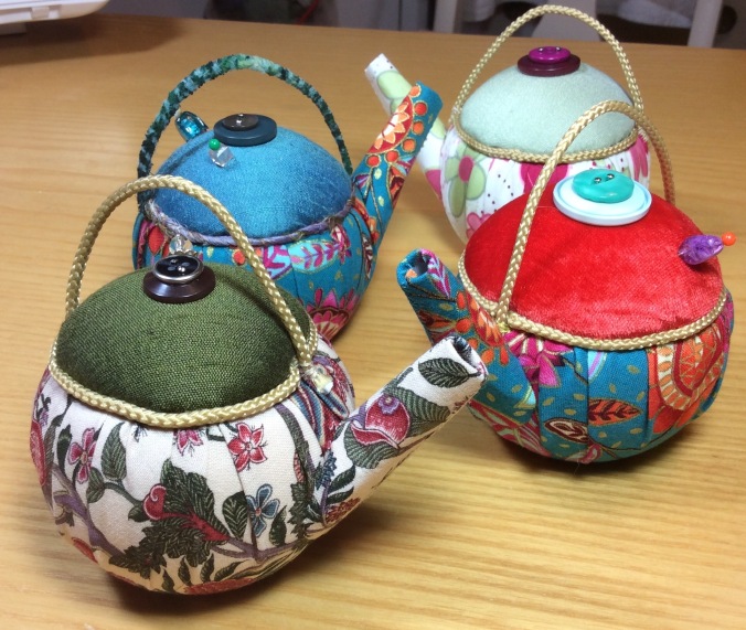 Multicoloured teapot pincushions