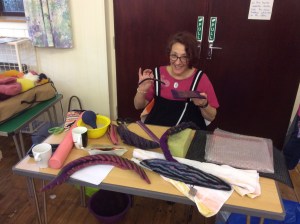 Mandy Nash demonstrating a particular wet felting technique at her workshop Experimental Sculptural Forms.