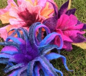 Wet felted flowers made with multiple resists