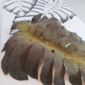 Large green wet felted 3D Monstera leaf mounted on hand painted background.